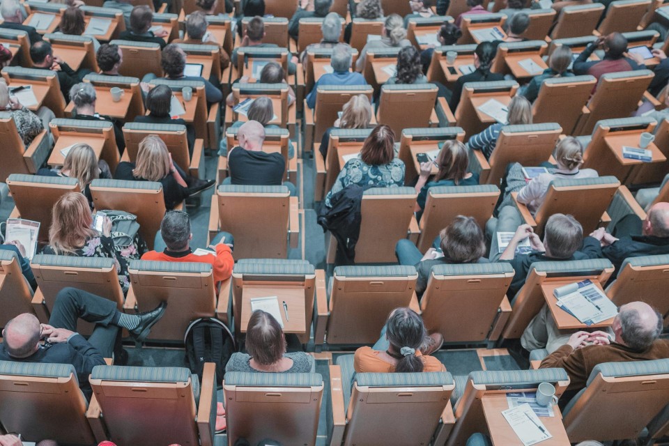 Lecture hall filled with attentive audience