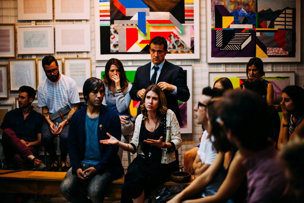 Group discussing art in gallery setting