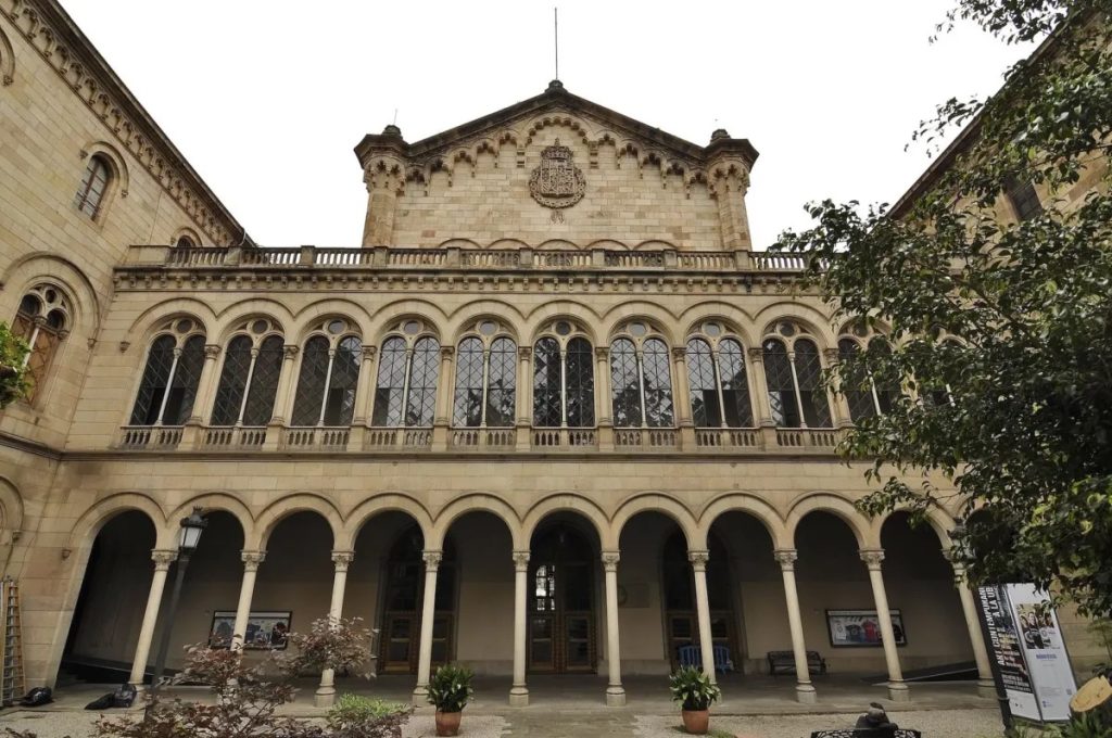 Historic building with arched windows, courtyard