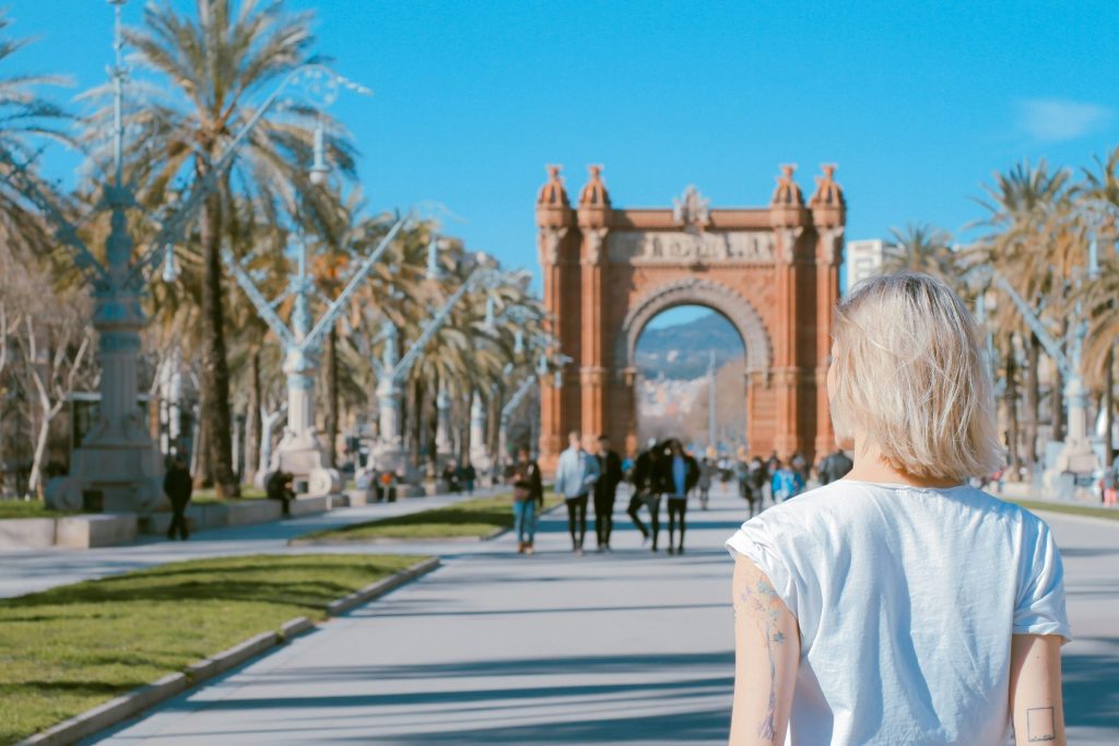 Person walking towards historic archway