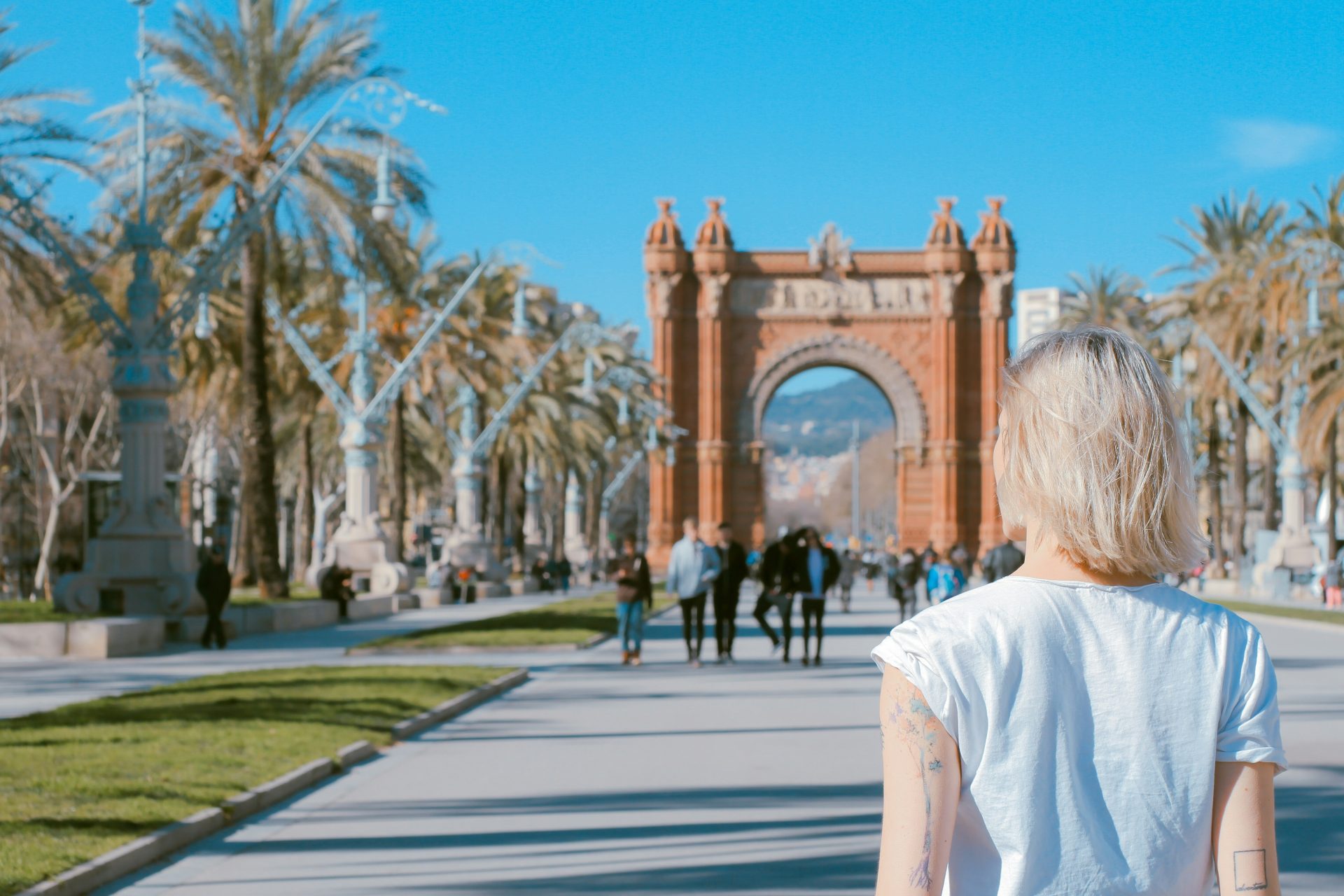 Person walking towards historic archway